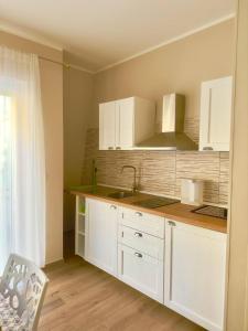 A cozinha ou cozinha compacta de Casa Luciana Apartment