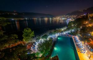 an overhead view of a swimming pool at night at Hunguest Hotel Sun Resort in Herceg-Novi