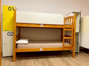 a bunk bed room with two bunk beds at Albergue O Burgo in O Pedrouzo