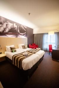 Postel nebo postele na pokoji v ubytování Hotel & Aparthotel Alize Mouscron + 37 fotografií