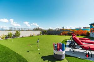 a golf course with a basket of pens and golf balls at Peaceful Getaway to a New Custom-Built Luxury Home in Rio Verde
