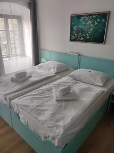 Postelja oz. postelje v sobi nastanitve Hotel Celerin