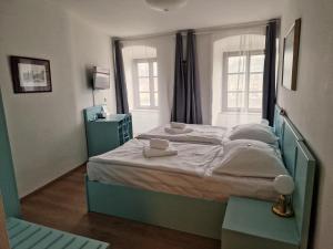 Postelja oz. postelje v sobi nastanitve Hotel Celerin