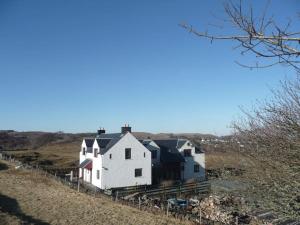 a group of houses on the side of a hill at Gamekeeper's Cottage in Tobermory