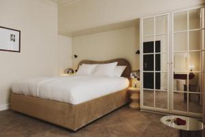 Llit o llits en una habitació de Hotel Bella Grande