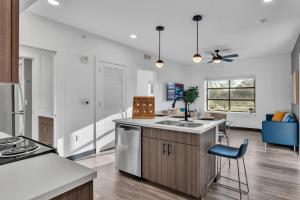 a kitchen with a sink and a stove at The Well #209 Apartment in Zephyrhills