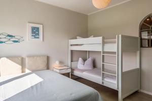Двухъярусная кровать или двухъярусные кровати в номере Ferienwohnung Drei