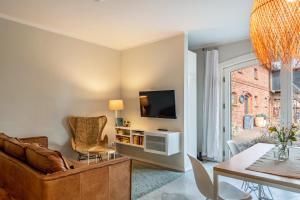 a living room with a couch and a table at Ferienwohnung Drei in Saal