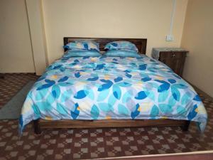 Postel nebo postele na pokoji v ubytování Sunrise Homestay