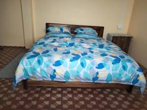 Postel nebo postele na pokoji v ubytování Sunrise Homestay