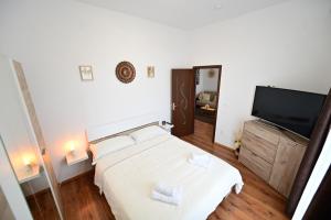 Postel nebo postele na pokoji v ubytování Penthouse 25