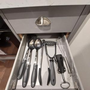a drawer filled with utensils in a kitchen at Kirkcudbright Holiday Apartments - Apartment A in Kirkcudbright