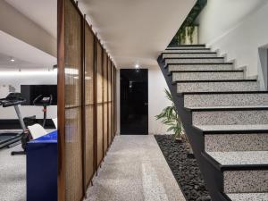 a staircase in a office building with a black stair case at The Newel Acropolis in Athens