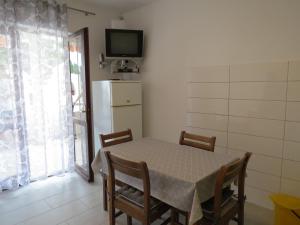 Kuchyň nebo kuchyňský kout v ubytování Apartments INES