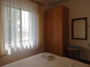 Postel nebo postele na pokoji v ubytování Apartments INES