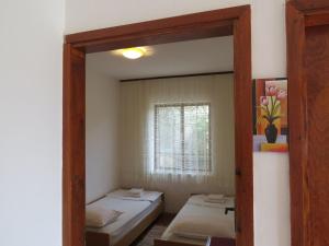 Postel nebo postele na pokoji v ubytování Apartments INES