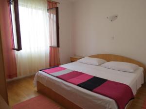 Postel nebo postele na pokoji v ubytování Apartments INES