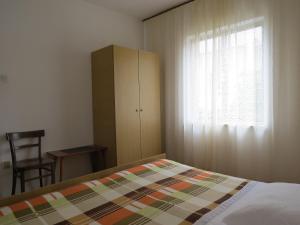 Postel nebo postele na pokoji v ubytování Apartments INES
