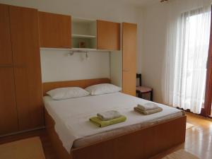 Postel nebo postele na pokoji v ubytování Apartments INES