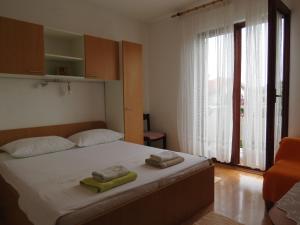 Postel nebo postele na pokoji v ubytování Apartments INES