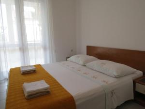 Postel nebo postele na pokoji v ubytování Apartments INES