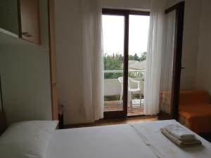 Postel nebo postele na pokoji v ubytování Apartments INES