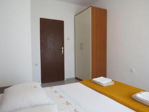Postel nebo postele na pokoji v ubytování Apartments INES