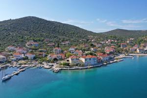 an aerial view of a small town on a body of water at Apartments Tiho in Vinišće