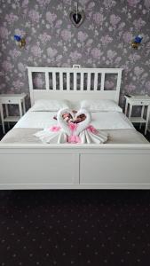 Voodi või voodid majutusasutuse Hotel Olimp toas