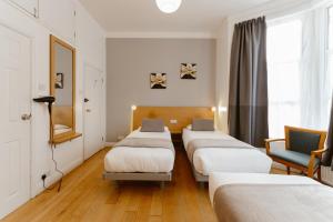 a row of beds in a hospital room at Star Hotel in London