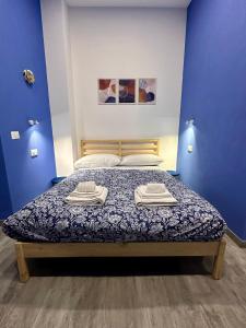 Un pat sau paturi într-o cameră la B&B I TRE SANTI