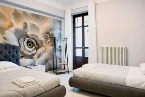Un pat sau paturi într-o cameră la Civico 16