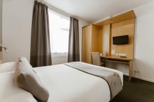 Cama o camas de una habitación en Star Hotel