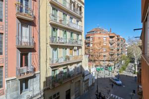 an aerial view of a city street with buildings at Ol Cute apartment in quiet Olivera st in Barcelona