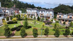a group of houses in a town with a park at ZINNIA RESIDENCE in Tanah Rata