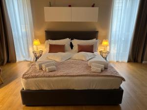 Posteľ alebo postele v izbe v ubytovaní Domus Suites Verona