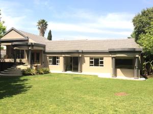 a house with a large yard in front of it at Korsmans Delights - Large House in Benoni