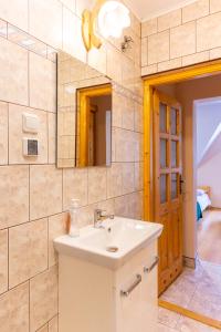 a bathroom with a sink and a mirror at Pokoje Gościnne Aniela Stasik in Gliczarów Górny +54 photos