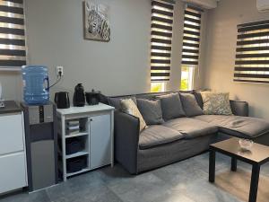 a living room with a couch and a table at Suriday Village in Wanica