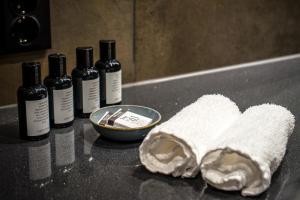 a towel and bottles of wine on a counter at Sorrisniva Arctic Wilderness Lodge in Alta