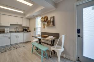 a kitchen with a table and chairs in a room at Relax Just Steps to the Soft White Sandy Beach, Heated Pool in Holmes Beach