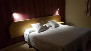 Posteľ alebo postele v izbe v ubytovaní Hotel Aguadoce - Louzao