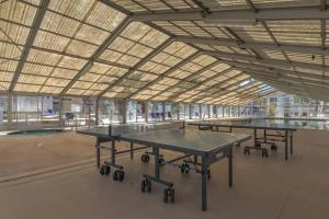 a group of ping pong tables in a large building at Perfect Family Escape - 3 Bed Condo with Pools in St. George