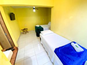 Pousada Jardim Lençóis客房内的一张或多张床位
