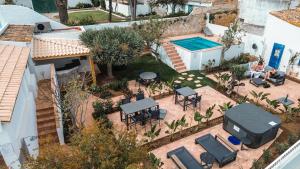 an aerial view of a backyard with a swimming pool at Old Fisherman's Corner 12 - Centro Old Town Albufeira in Albufeira