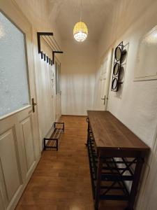 a hallway with a table and chairs in a room at Apartmenthaus Delitzsch 1-2 Zimmer Apartments in Delitzsch