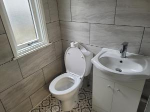 a bathroom with a toilet and a sink at Beautiful 1-Bed Apartment in Ramsgate in Ramsgate
