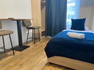 Ein Bett oder Betten in einem Zimmer der Unterkunft Aparthotel Lenau