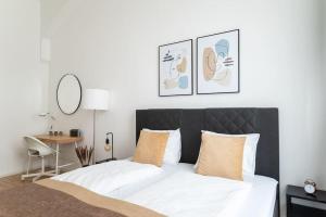 Letto o letti in una camera di Neat Studio Steps to Center by HM