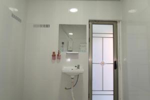 a bathroom with a sink and a mirror at Waterfall Guesthouse in Koh Rong Island